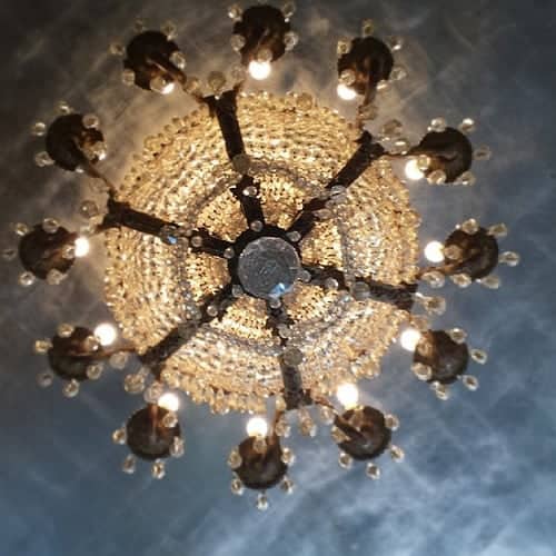 Ornate crystal chandelier viewed from directly below