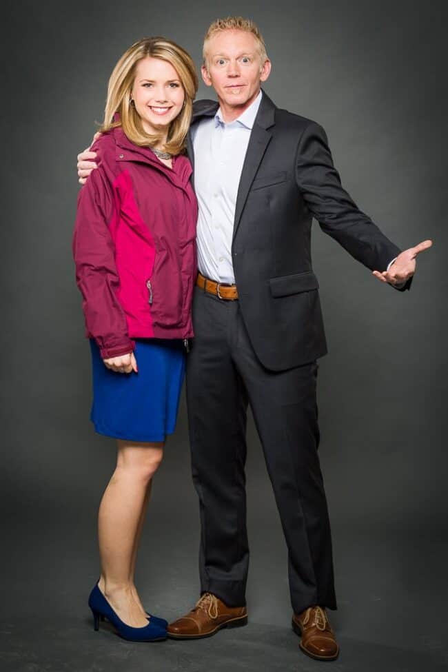Portrait of two KPTV news anchors against a gray studio backdrop