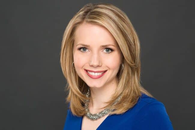 Professional headshot portrait of Nora Hart for KPTV against a gray studio backdrop
