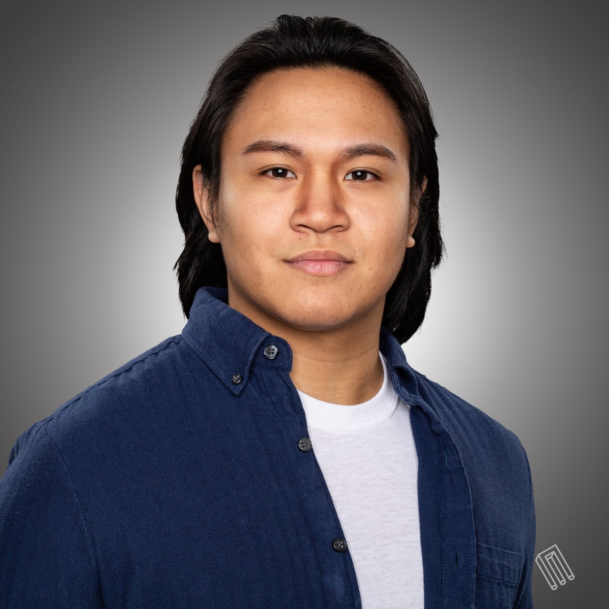 Man with short dark hair, white shirt under navy blazer, color, direct smile