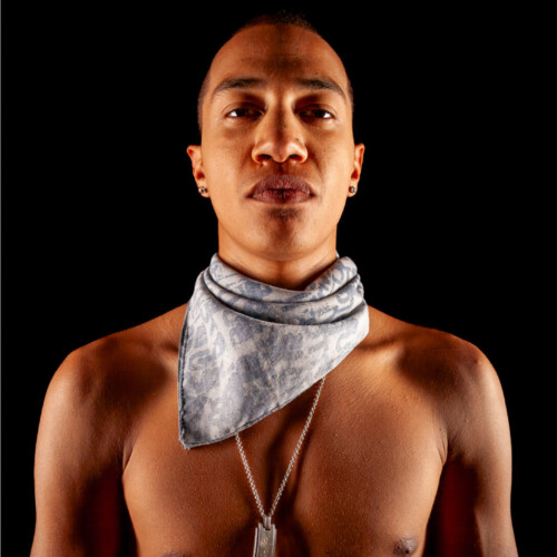 Three-panel triptych of a shirtless man wearing a gray bandana and dog tags, smoking, against a black background