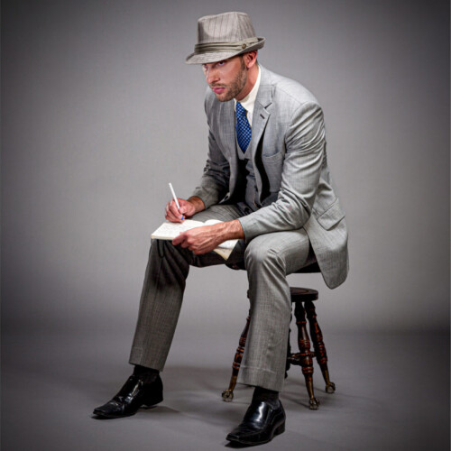 Three-panel triptych of a man in a gray pinstripe suit and fedora, writing while seated on a stool